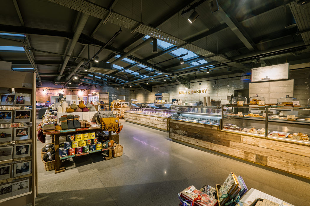 Food produce, drinks and lifestyle products on display units and shelving with fresh food counters in the background at Basecamp North Lakes farm shop