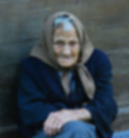 Old woman in coat and scarf
