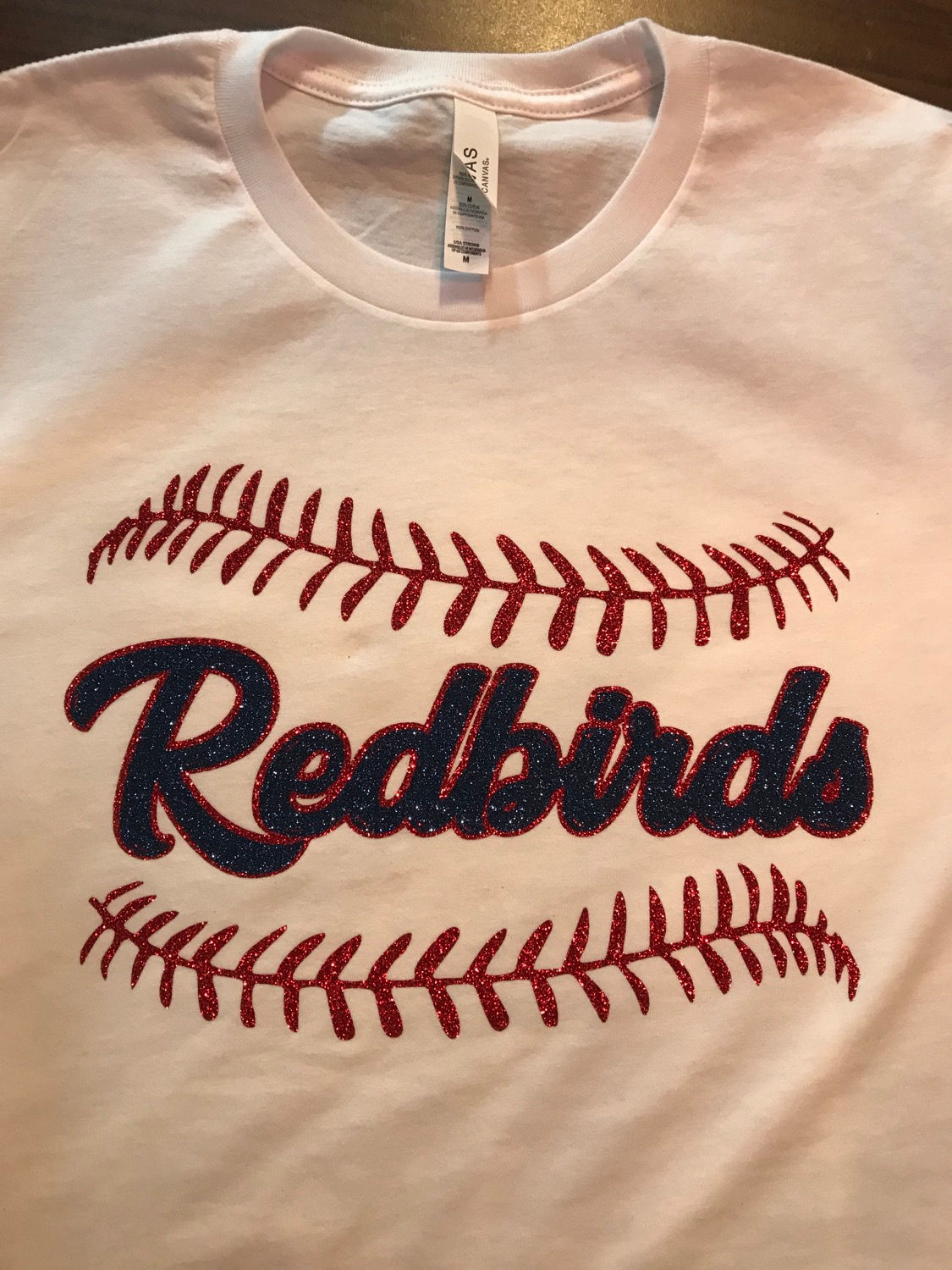 Redbirds with laces and cursive writing