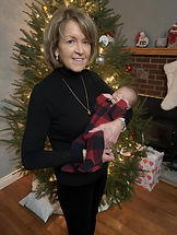 A picture of Betty Jean holding her 2 week old grandson.