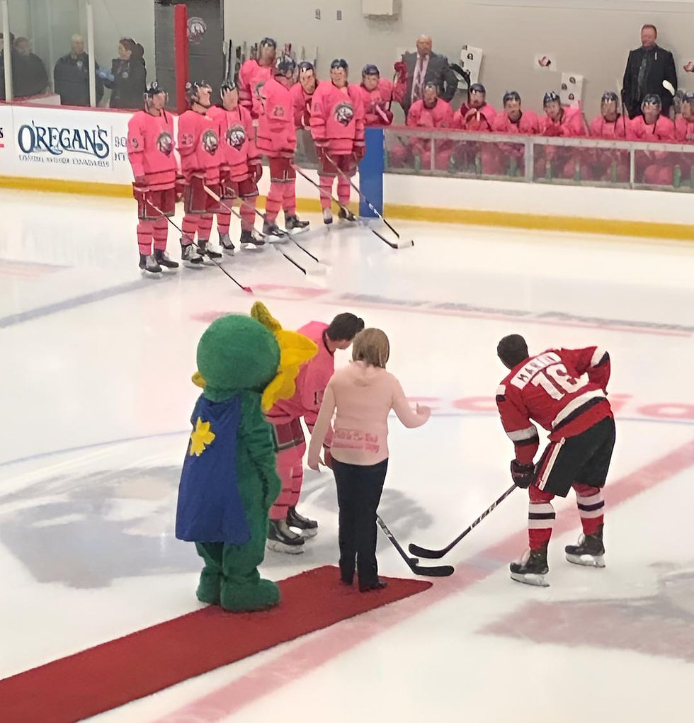 Betty Jean is dropping the puck at a hockey game in support of Breast Cancer.