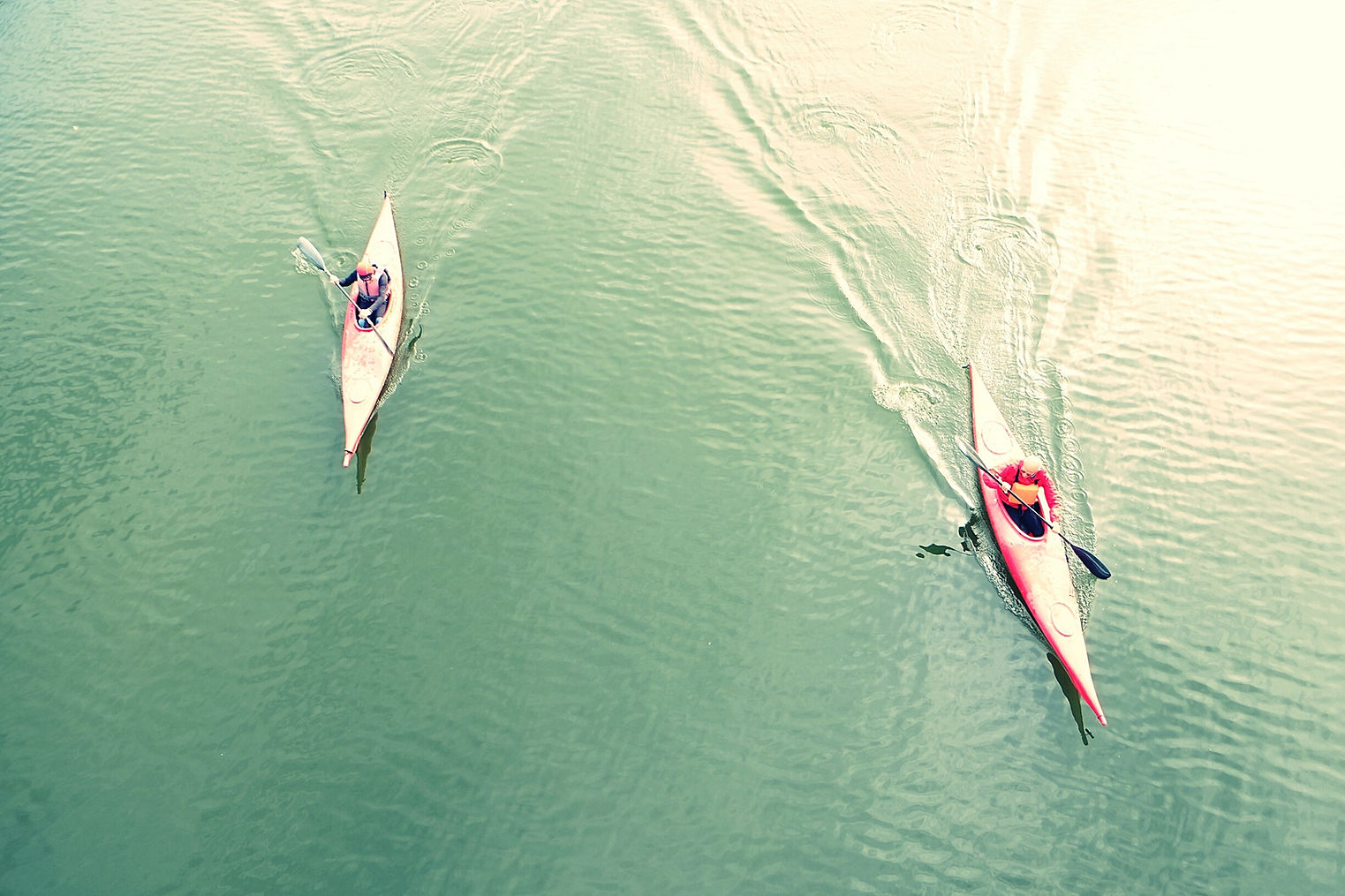High Angle View Of People Kayaking In Lake