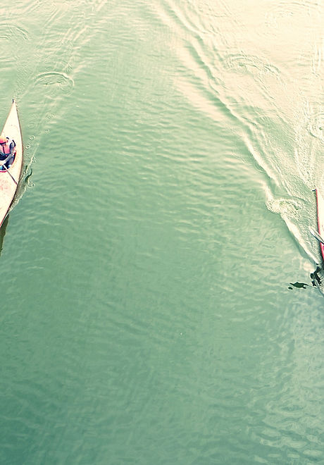 High Angle View Of People Kayaking In Lake