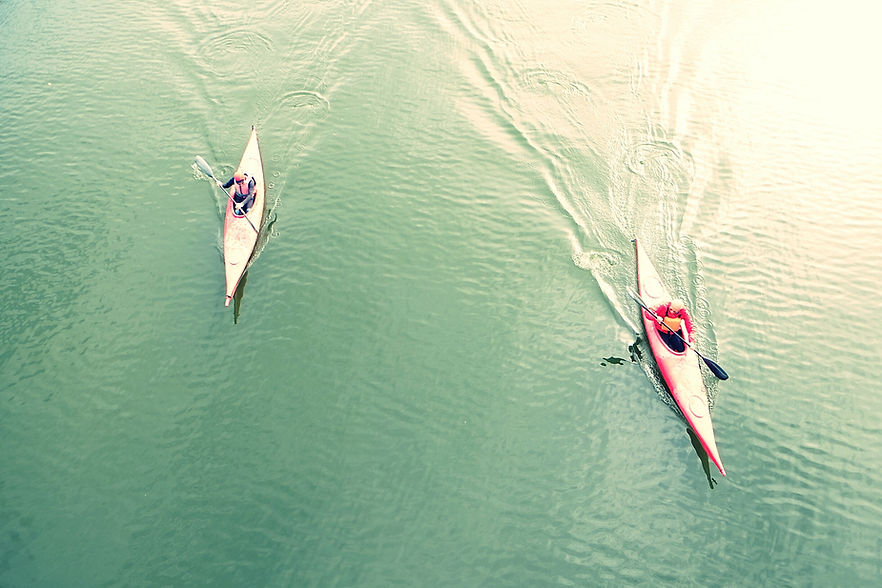 High Angle View Of People Kayaking In Lake