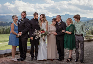 Candid family photo with an Adirondack Mountain Backdrop at a wedding in Lake Placid NY at