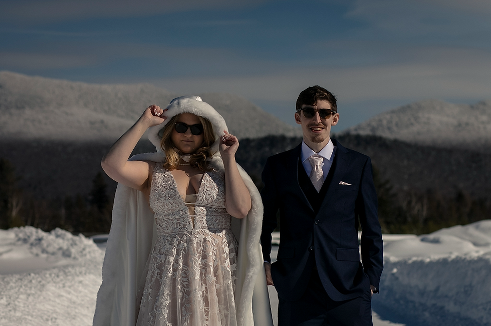 An Bride and Groom stand in front of Whiteface mountain for their Adirondack Elopement