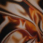 A luxurious flowing satin fabric with amber and gold folds.