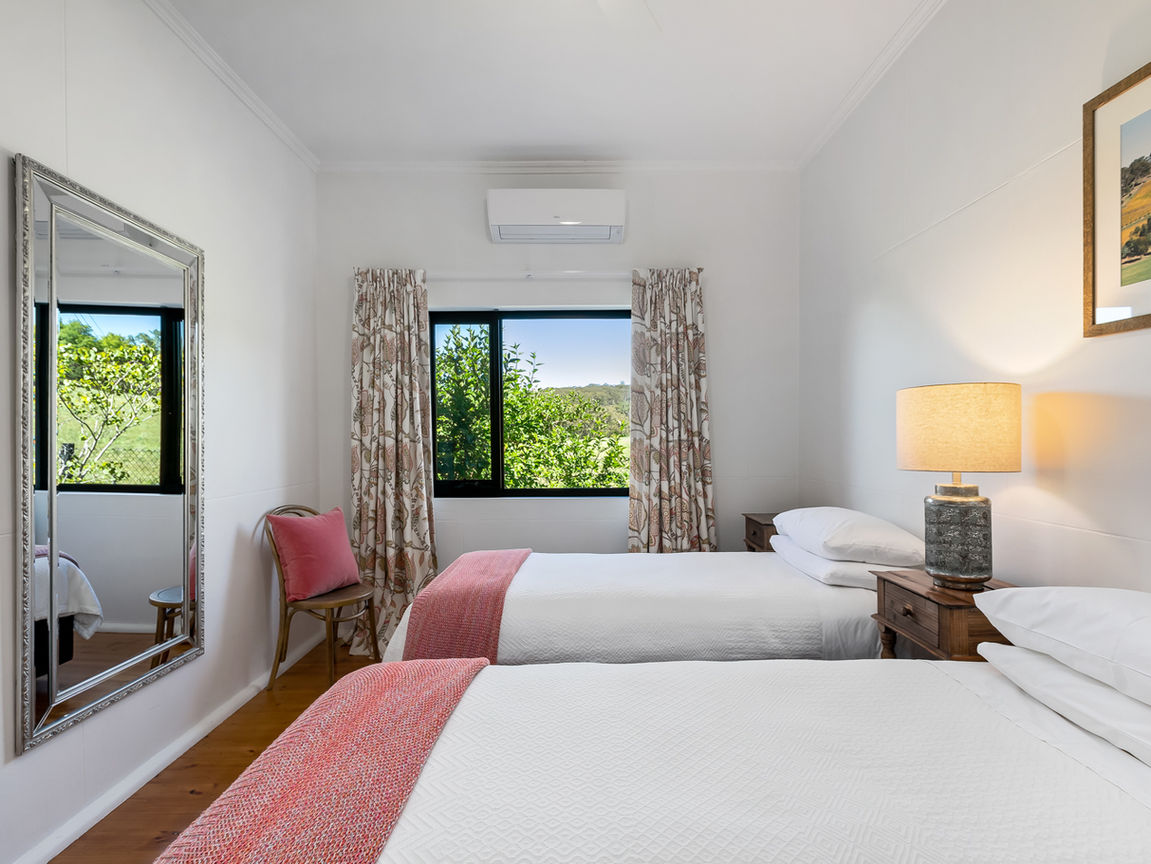 a bed with 2 single beds