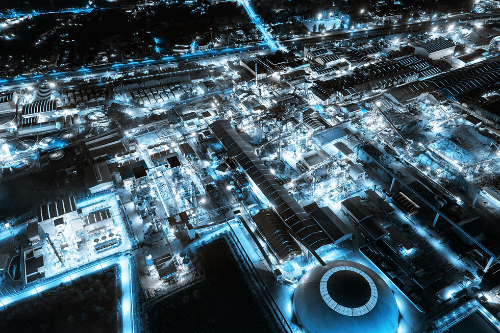 aerial-view-of-blue-light-industrial-factory-with-chemical-refinery-and-building-material-