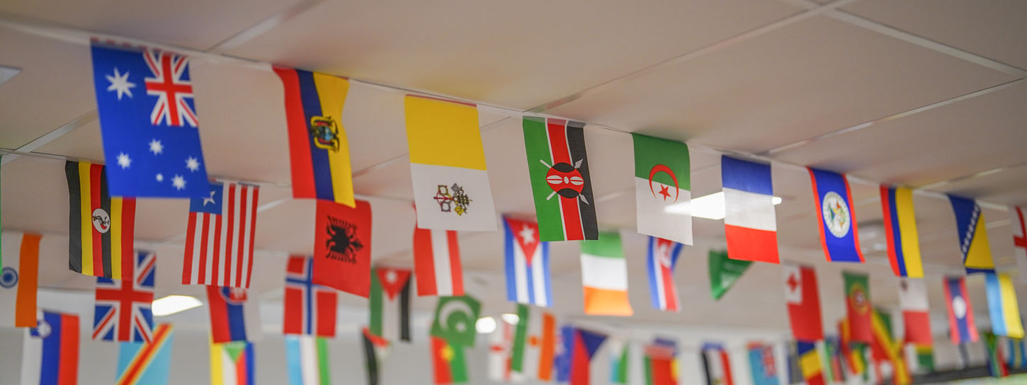 flags hanging in a classroom