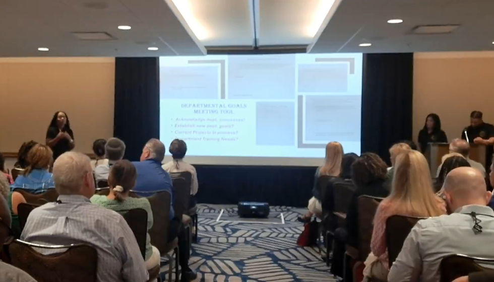 Eye-level view of nursing staff collaborating during a team meeting