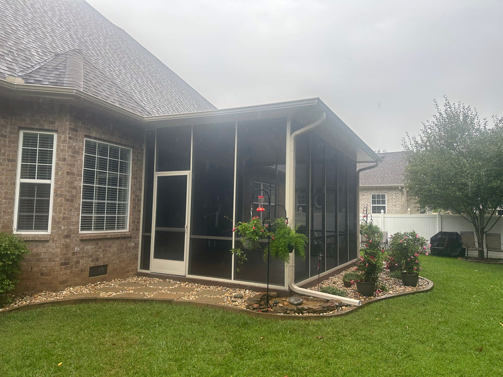 Carport at back of house over concrete driveway.