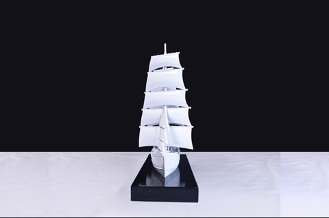 Front view of White old times ship with sails on a black and white background