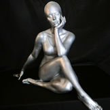 silver women sitting with crossed legs