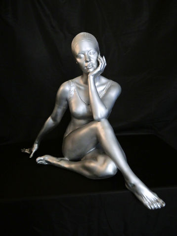 silver women sitting with crossed legs