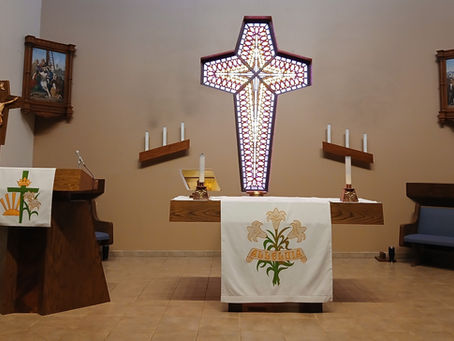 chancel with altar, pulpit, candles, artwork