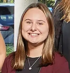 Lizzy Rifenburg wears a maroon jacket