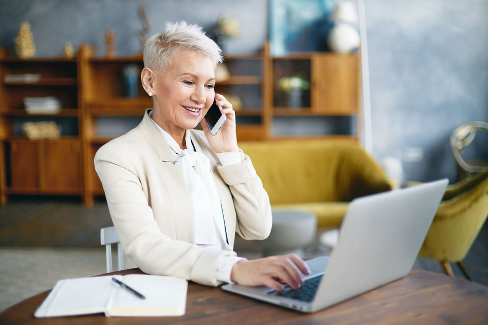 A senior businesswoman calls customer service to check on a spam email