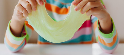 child-stretches-mucus-sides-children-s-hands-are-playing-slime-making-slime-copyspace-sele