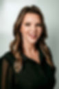 Laura Hays, APRN, FNP-C has long hair with highlights and large brown eyes