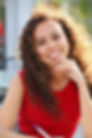 A Texas woman with white teeth smiles.