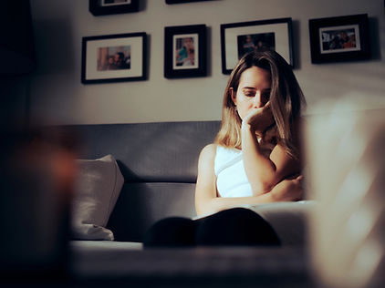 A sad woman at a therapy appointment