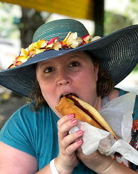 Jodie - eating hot dog at Aunty Sandys - Maui - April 2019.jpeg