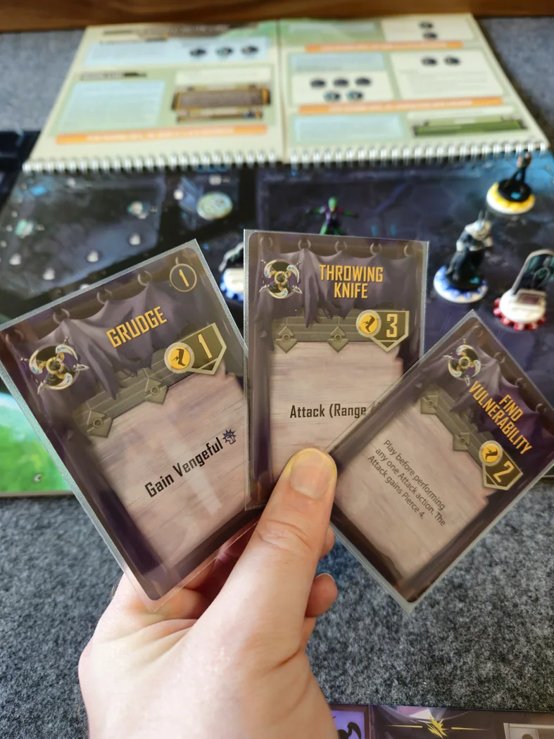 A player holds three Phantom Epoch Action cards, with their Action Point costs visible