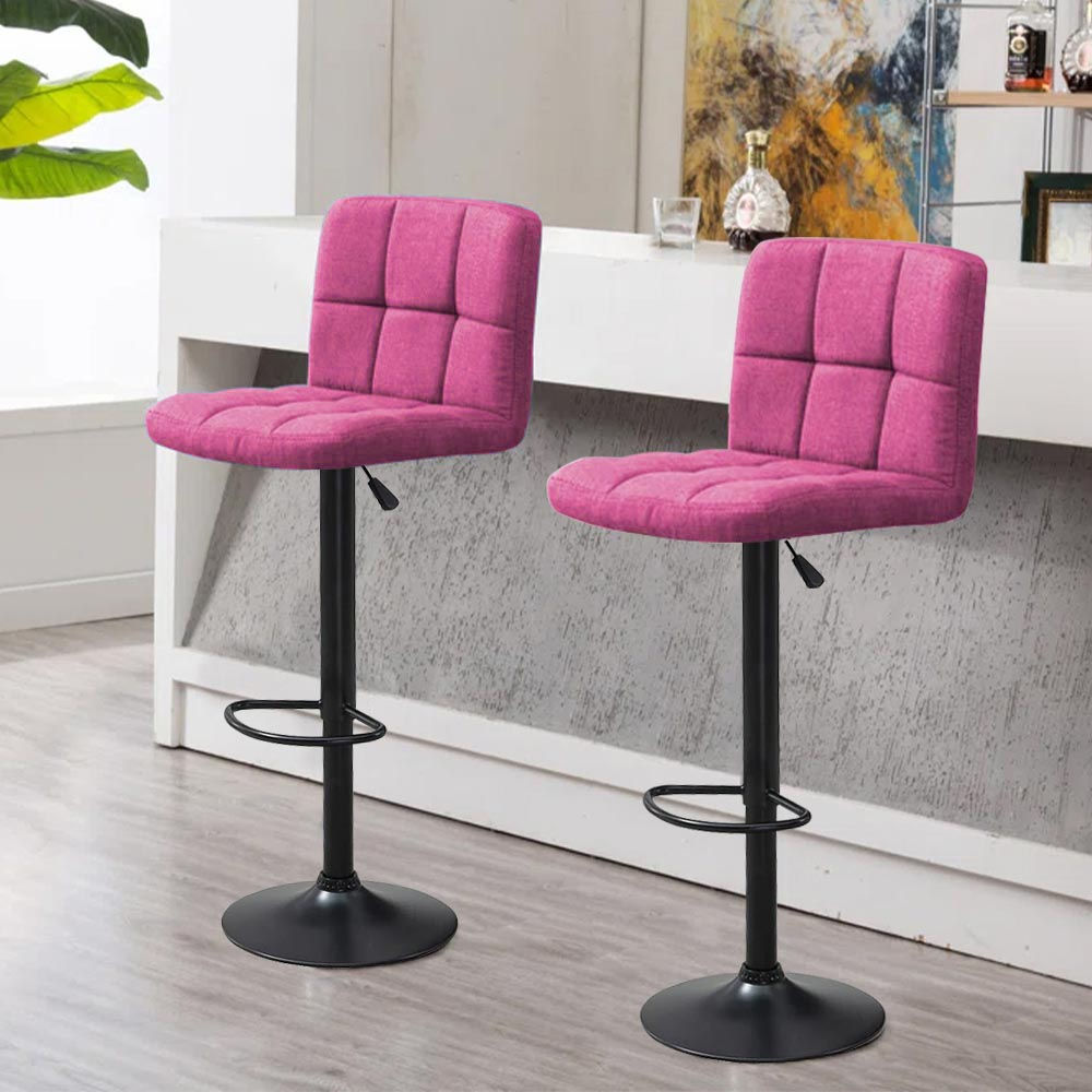 Deux tabourets de bar roses