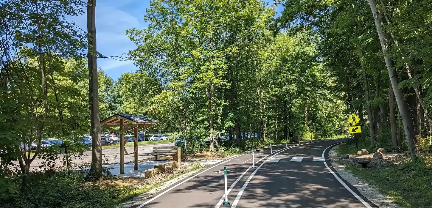 Multi-Use Path running through park allowing for foot traffic, bicycle traffic, and vehicle traffic.