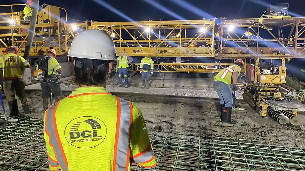 Intern on bridge deck pour construction site