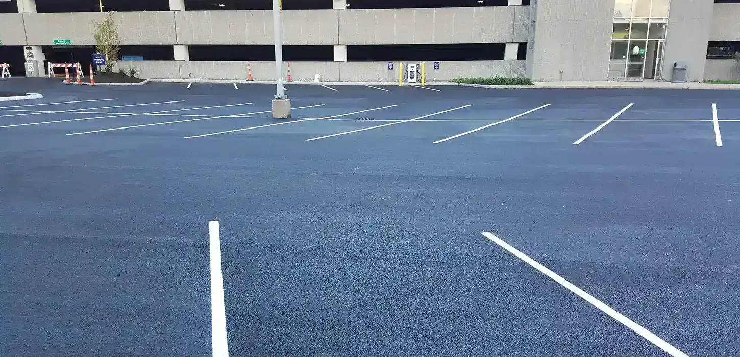 Parking lot after reconstruction. There are freshly painted parking spots.
