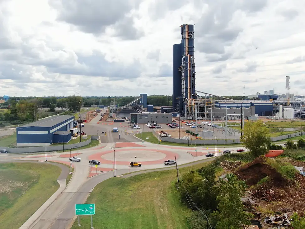 5 Leg concrete roundabout engineered for industrial usage with red stamped concrete islands and truck skirt. Cleveland Cliffs and Toledo Lucas County Port Authority in the background. 