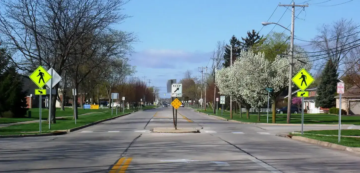 Crosswalk with pedestrian crossing signs on either side.