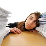 Student surrounded by papers
