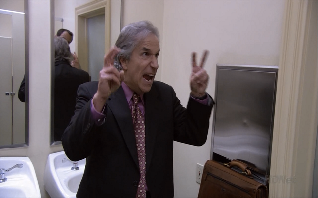 Barry making bunny ears with fingers