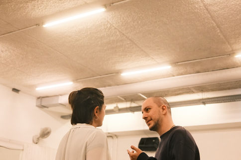 Two actors discuss a scene during a ZEST Farragut North studio rehearsal, June 2026.