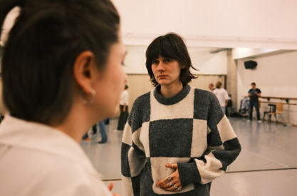 Actor in a checkered jumper during a studio rehearsal for ZEST's Farragut North, June 2026.