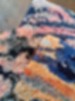 Three coloured knotted rug samples