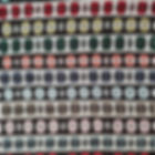 Front of multicoloured handwoven lap rug showing circle pattern