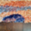 Detail of orange and blue knotted rug sample