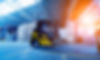 stock-photo-forklift-loader-in-storage-warehouse-ship-yard-distribution-products-delivery-