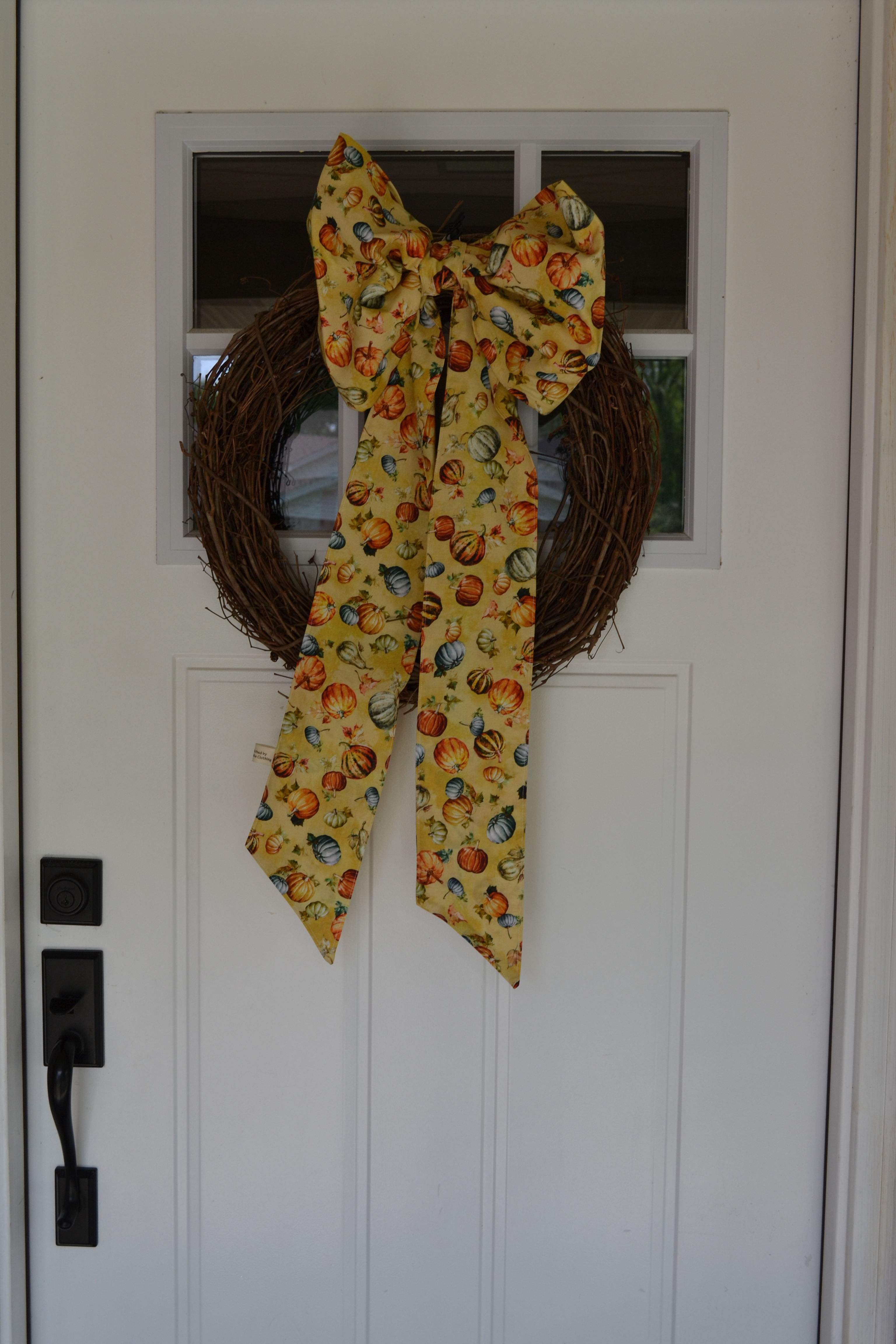 Golden pumkin door bow