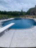 Custom gunite pool in St. Louis, MO with diving board.