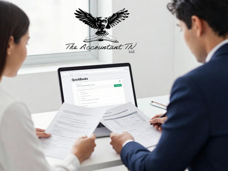 Man and woman sitting at a desk reviewing financial paperwork and accounting documents together, discussing business records and planning a QuickBooks Desktop to Online migration.