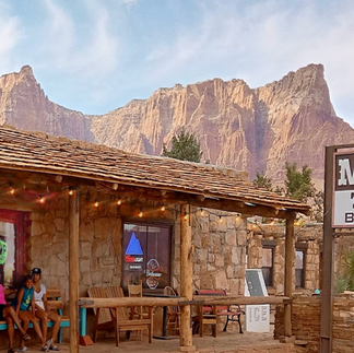 Swapping trail stories on the patio with a spectacular front-row view of the red Vermilion Cliffs.