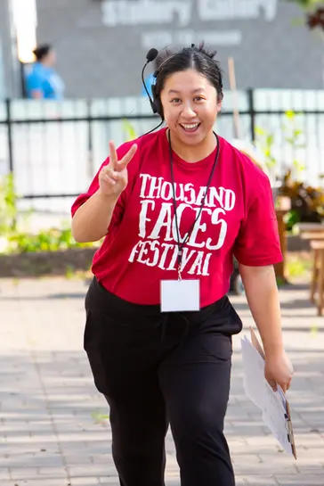 A Thousand Faces Festival employee smiling