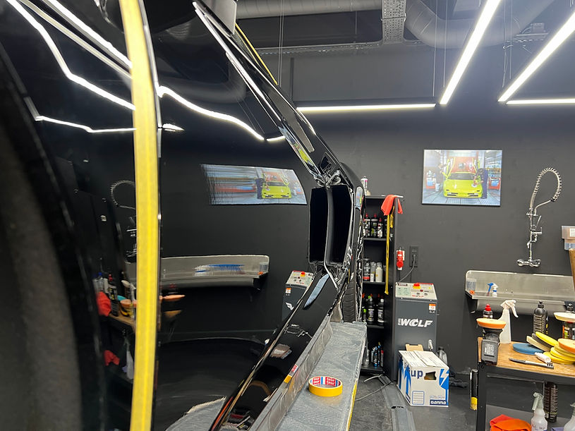 Black Audi R8 undergoing mirror-polish detailing