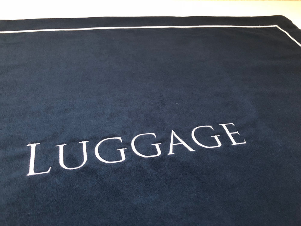 Protect your Guest Bedding with Luggage Mats