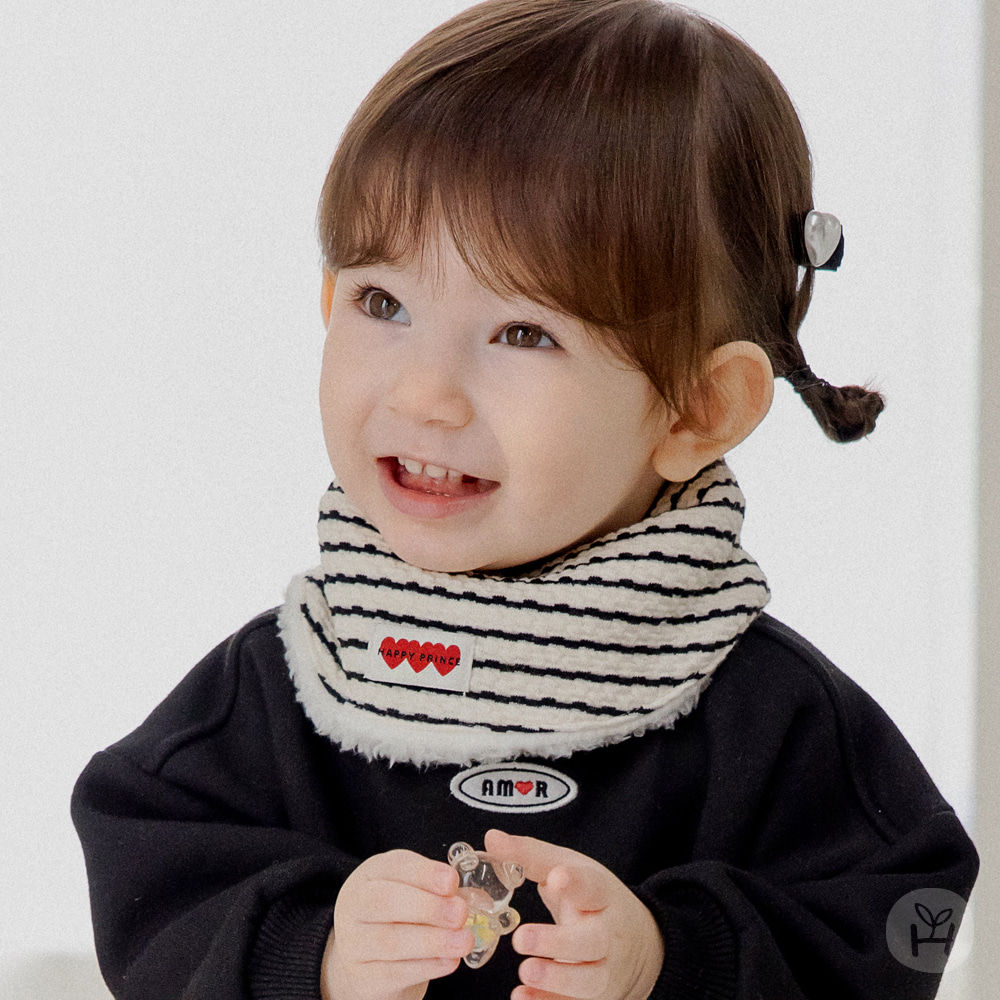 The Morris Snow Baby Bib combines functionality and style with its unique striped embossed design. Featuring a charming heart